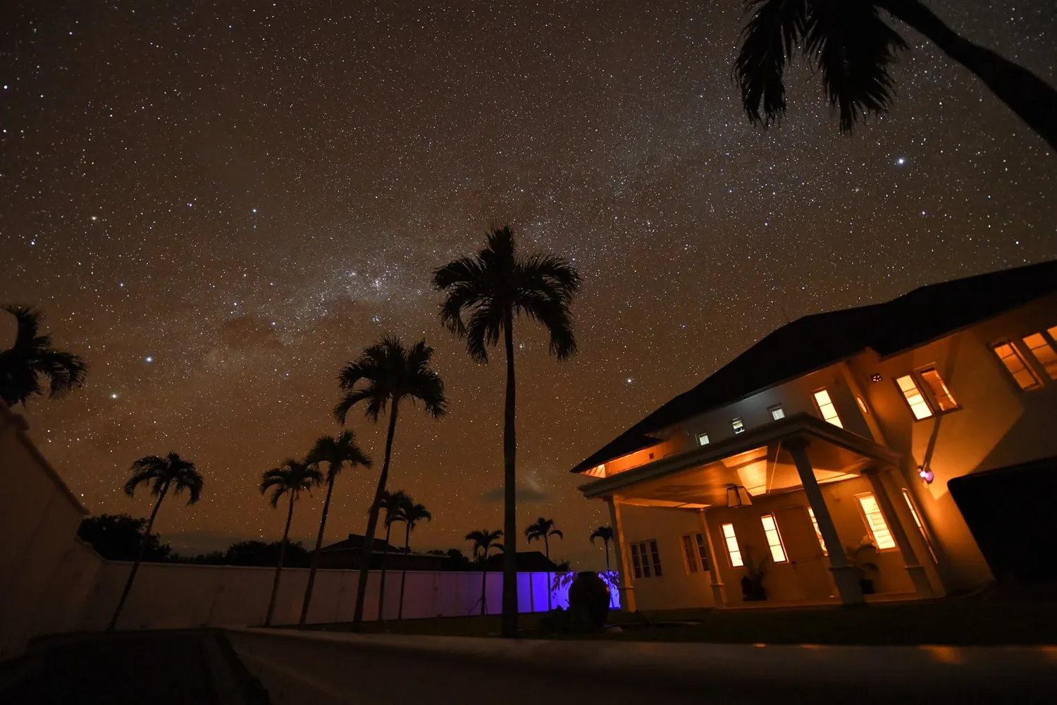 The villa lit at night